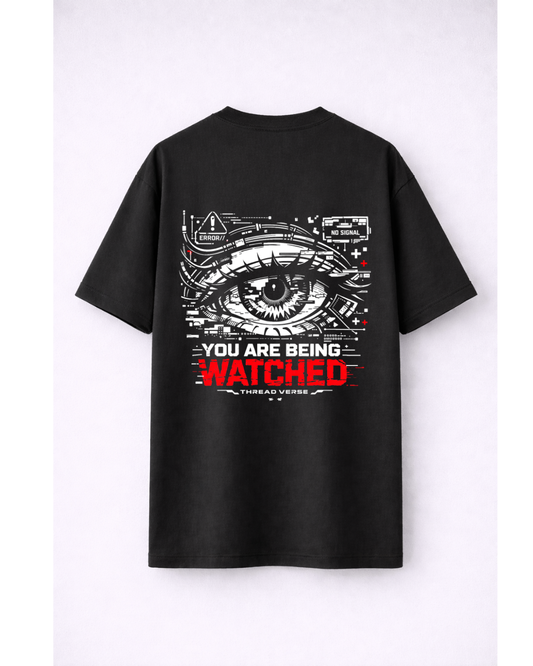 You Are Being Watched Oversized T-Shirt | Cyberpunk Eye Graphic Black Tee | ThreadVerse